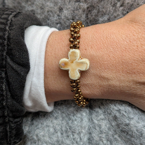 Skadi Cross Bronze croix beige