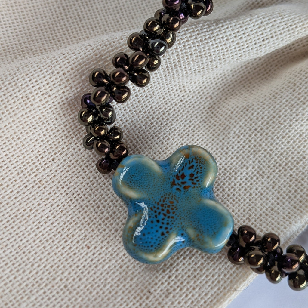 Skadi cross croix bleu et irisé